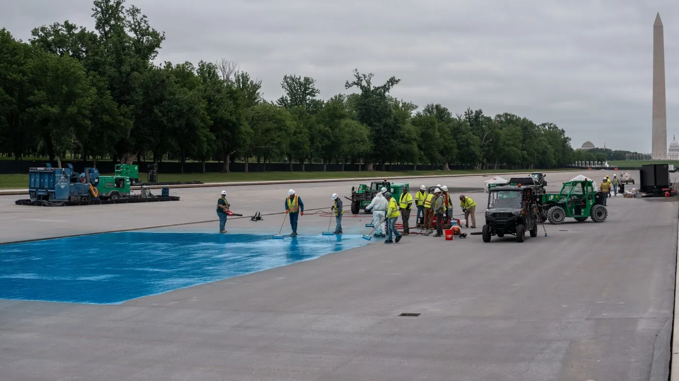 The Lincoln Memorial Reflecting Pool drained and under resurfacing work, with the exposed basin and repair activity visible