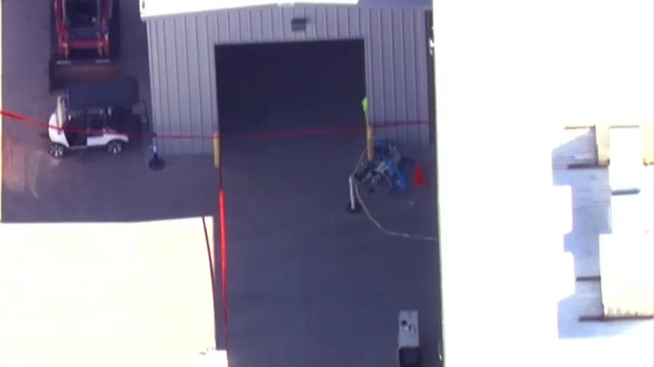Investigators examining the scene after two Amazon delivery drones struck a construction crane in Tolleson, Arizona