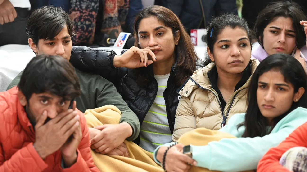Indian wrestlers seated at the Jantar Mantar protest in New Delhi in January 2023