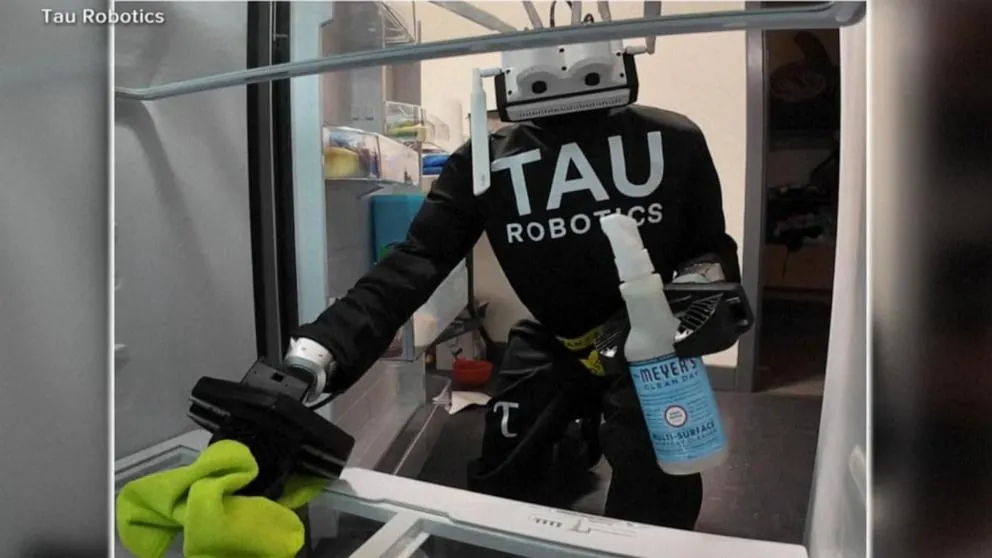 Tau Robotics humanoid robot cleaning inside a home during a teleoperated service