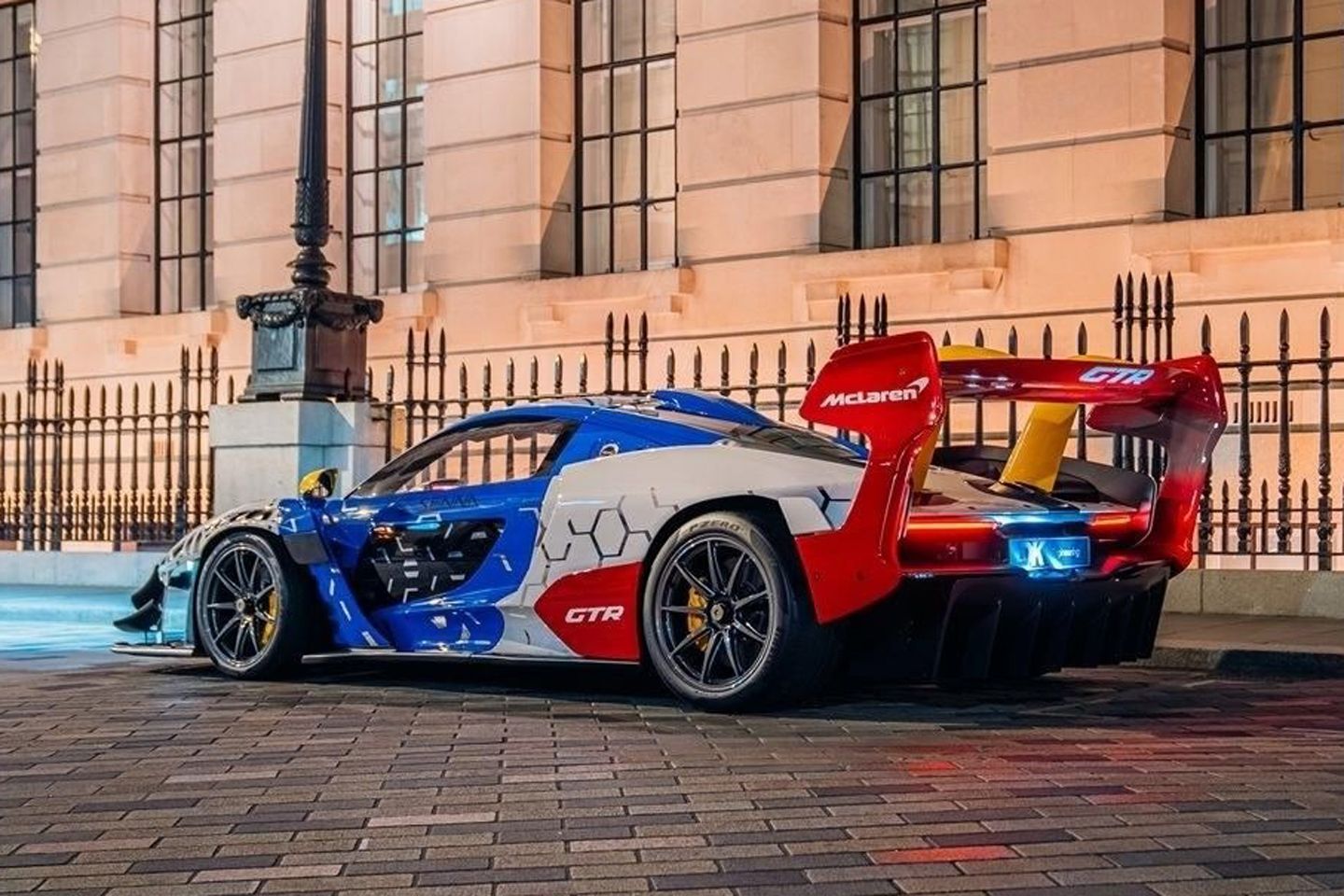 Lanzante-converted orange McLaren Senna GTR on a public road with license plates