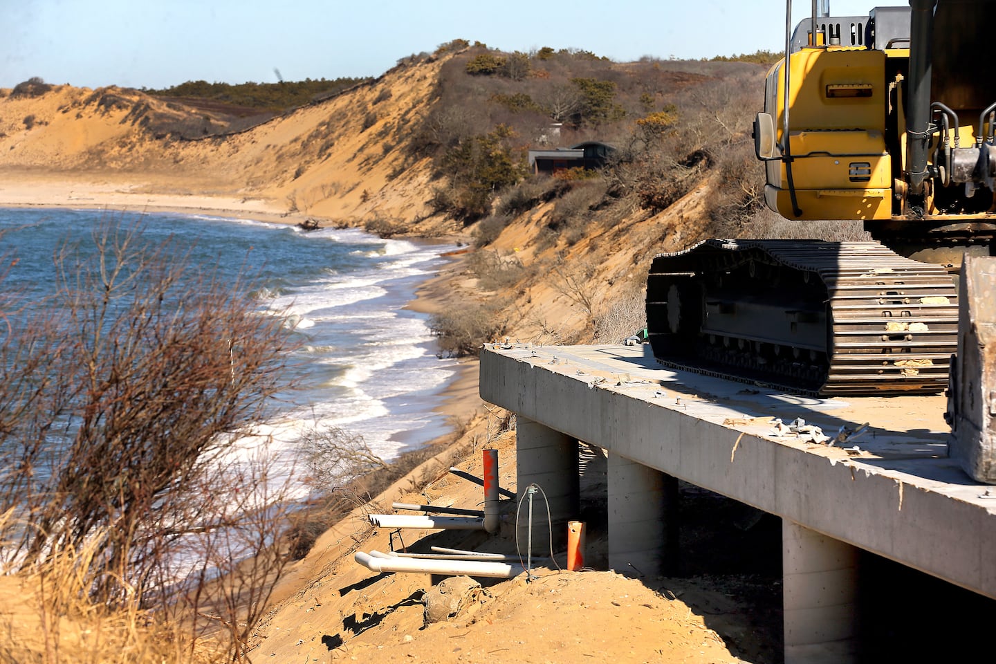 The Blasch House perched on an eroded coastal cliff in Wellfleet