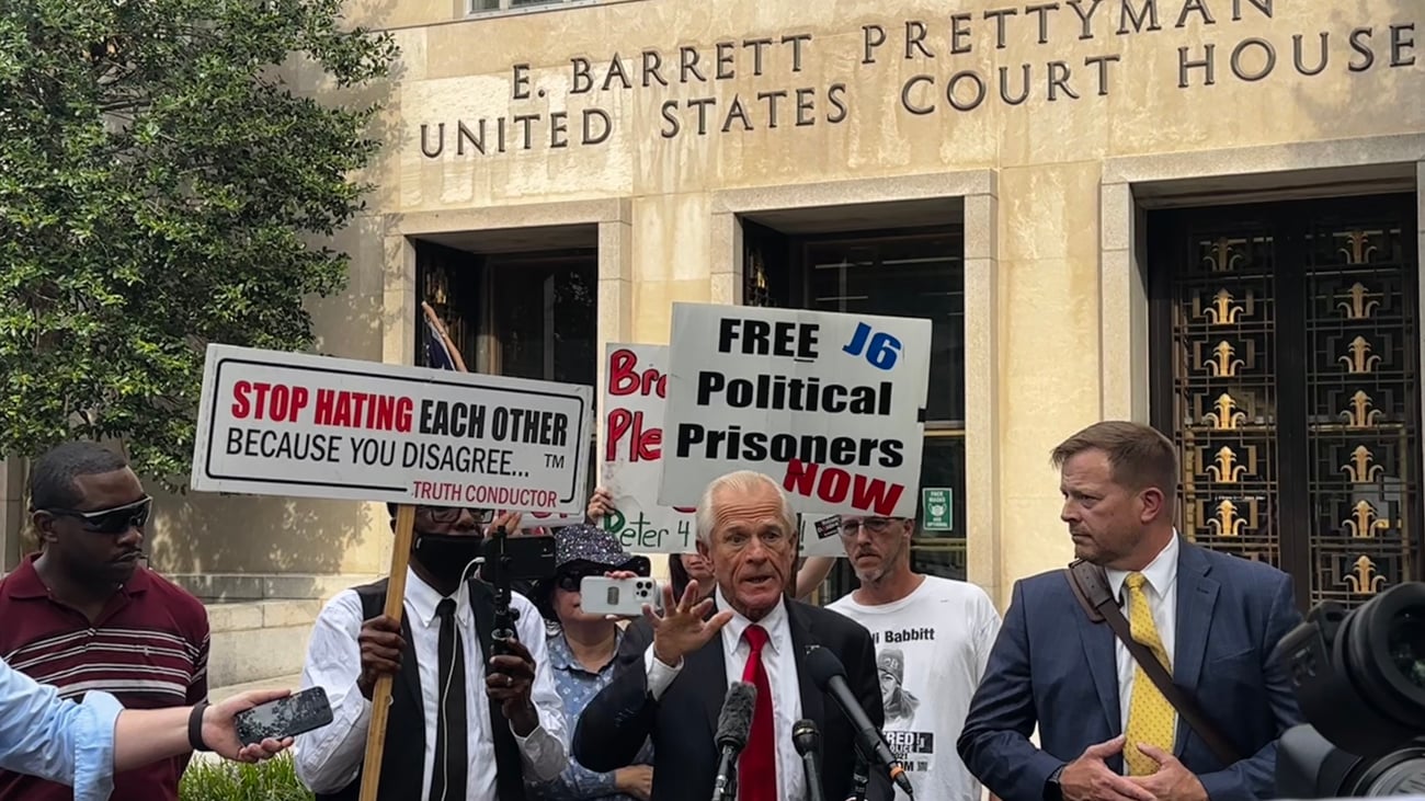 Peter Navarro speaking to reporters outside the E. Barrett Prettyman United States Courthouse in Washington, DC