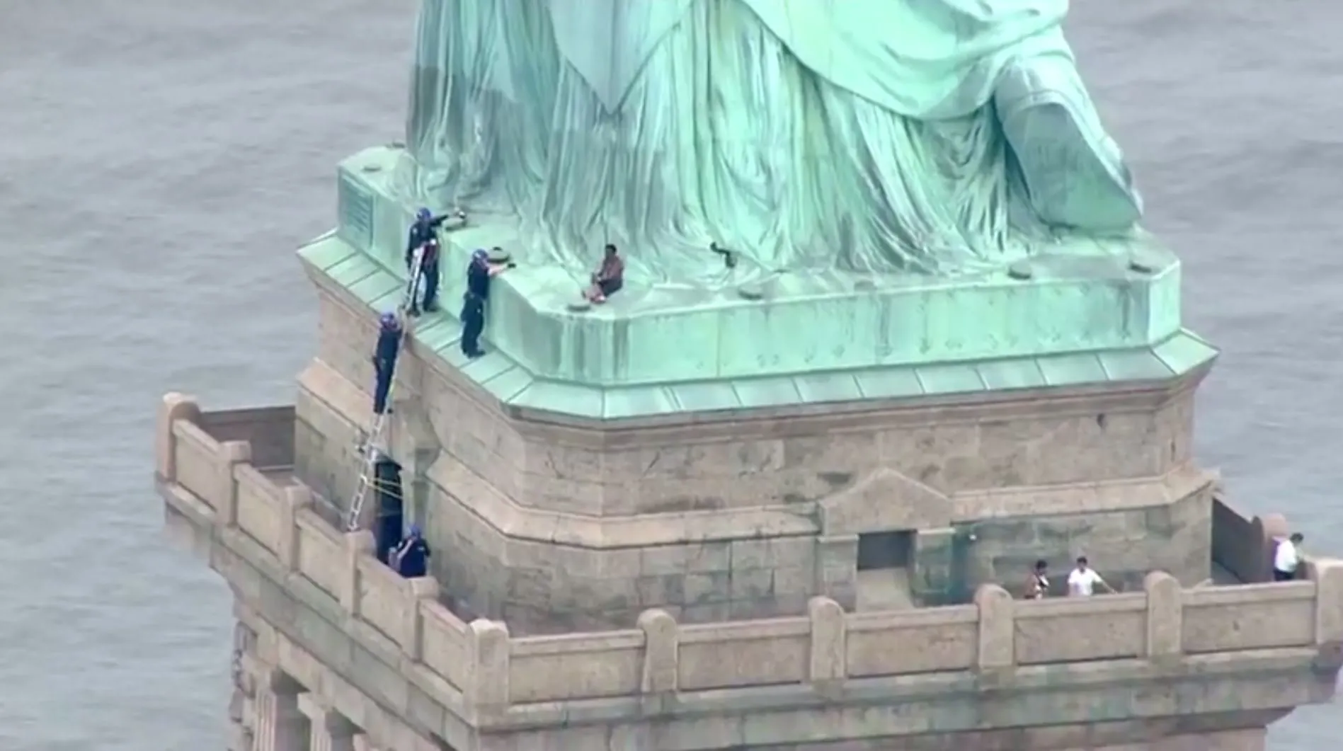 Therese Okoumou climbing the Statue of Liberty during the July 4, 2018 protest incident