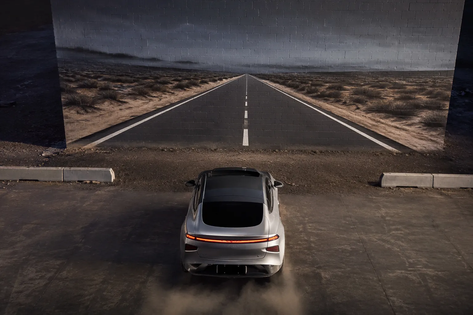 Electric vehicle approaching a brick wall painted with a road scene