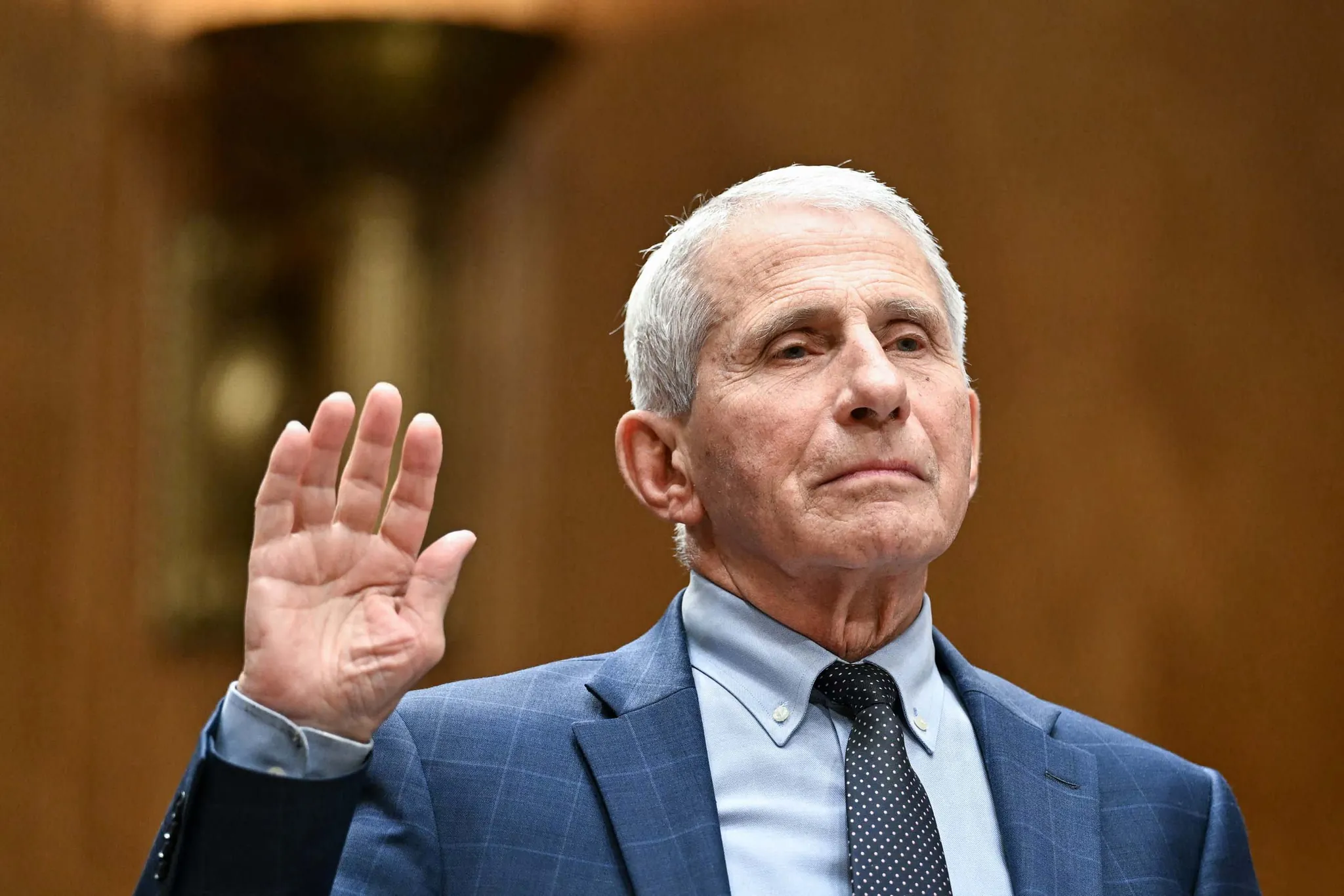 Dr. Anthony Fauci seated at a Senate hearing table before the Homeland Security and Governmental Affairs Committee