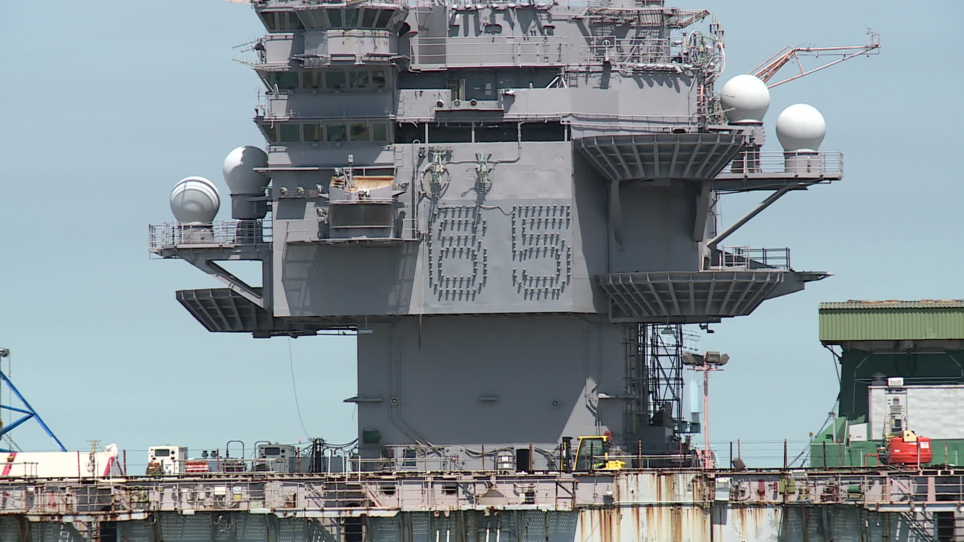 Former USS Enterprise at a Newport News pier after defueling and removal of mast and radars