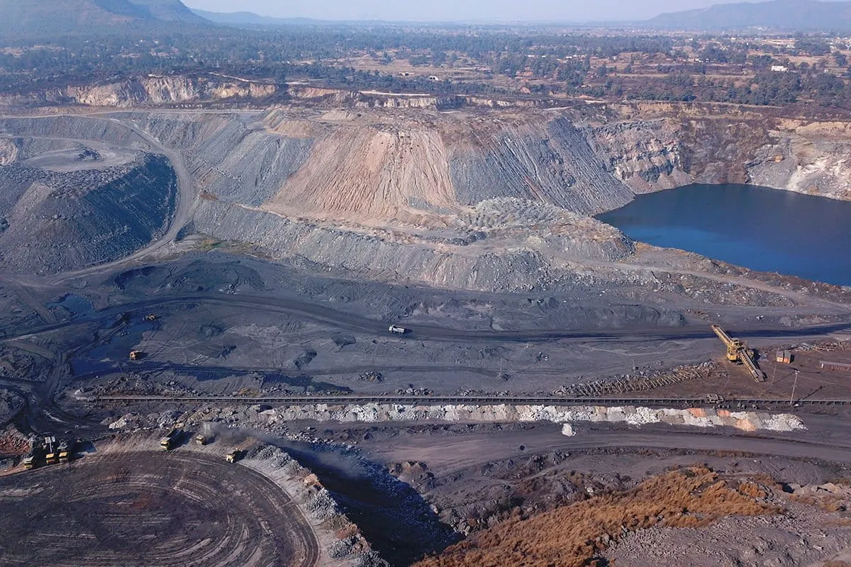 Terraced overburden benches and reclaimed slopes at the Piparwar open-cast coal mine in Jharkhand