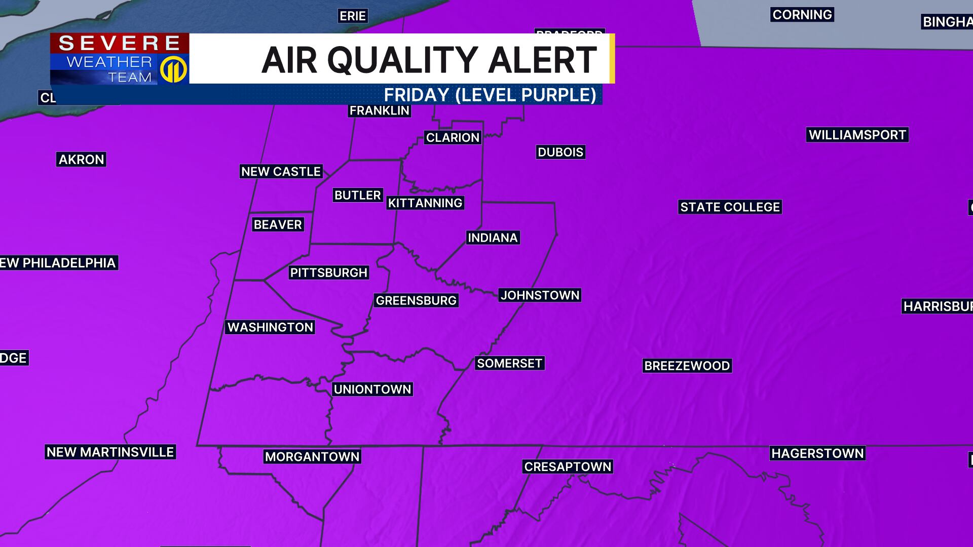 Broadcast graphic showing a statewide Pennsylvania Code Purple Air Quality Alert over wildfire smoke imagery